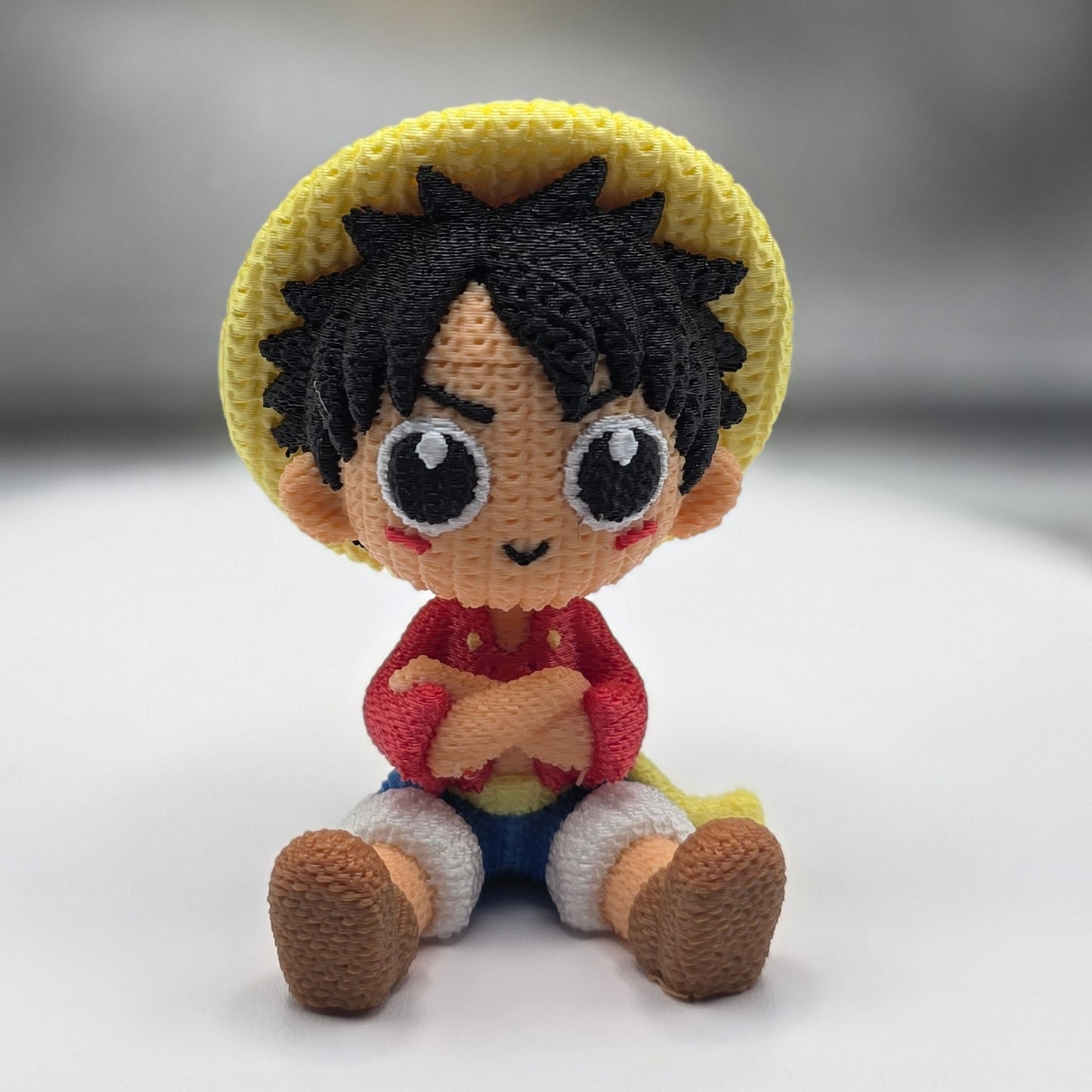 Small crocheted figurine of a character with a blurred background