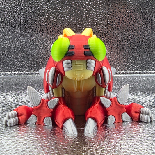 Toy figure of a red and yellow creature with green accents on a textured surface