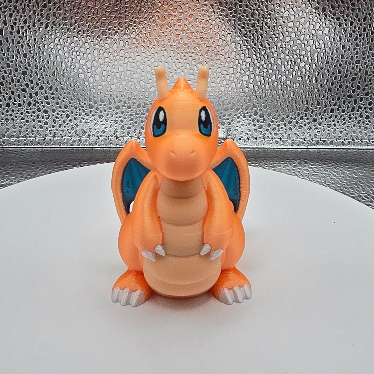 Small figurine of a cartoon character on a textured surface