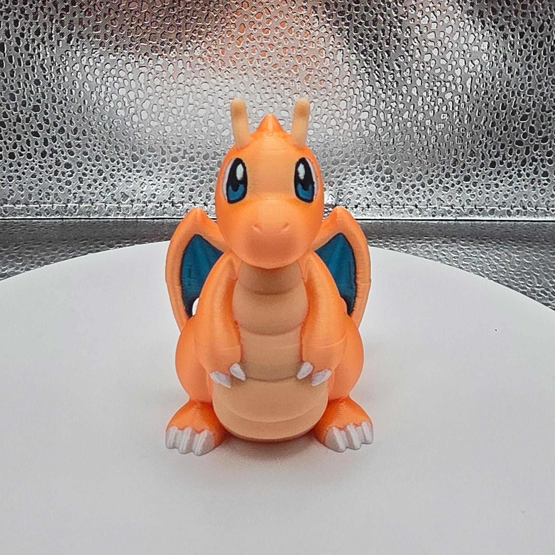 Small figurine of a cartoon character on a textured surface